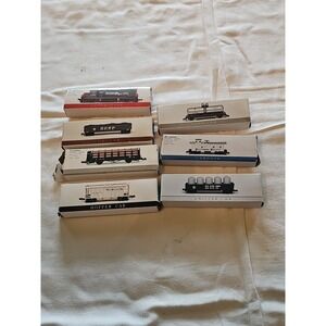 7 Train Car Collection.  Original  Boxes (One box Is Torn) All Cars are included